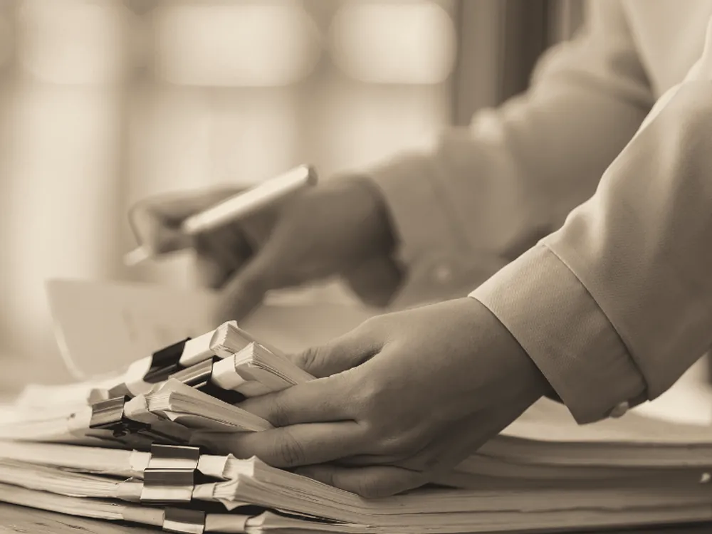 Stacks of paper invoices with tabs